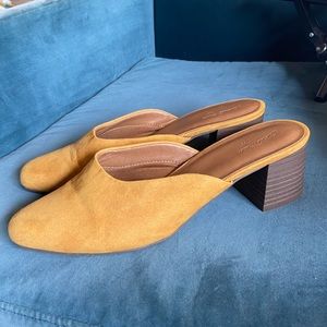 Mustard yellow mules.